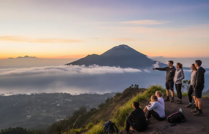 Group at Mount Batur summit with lake panorama